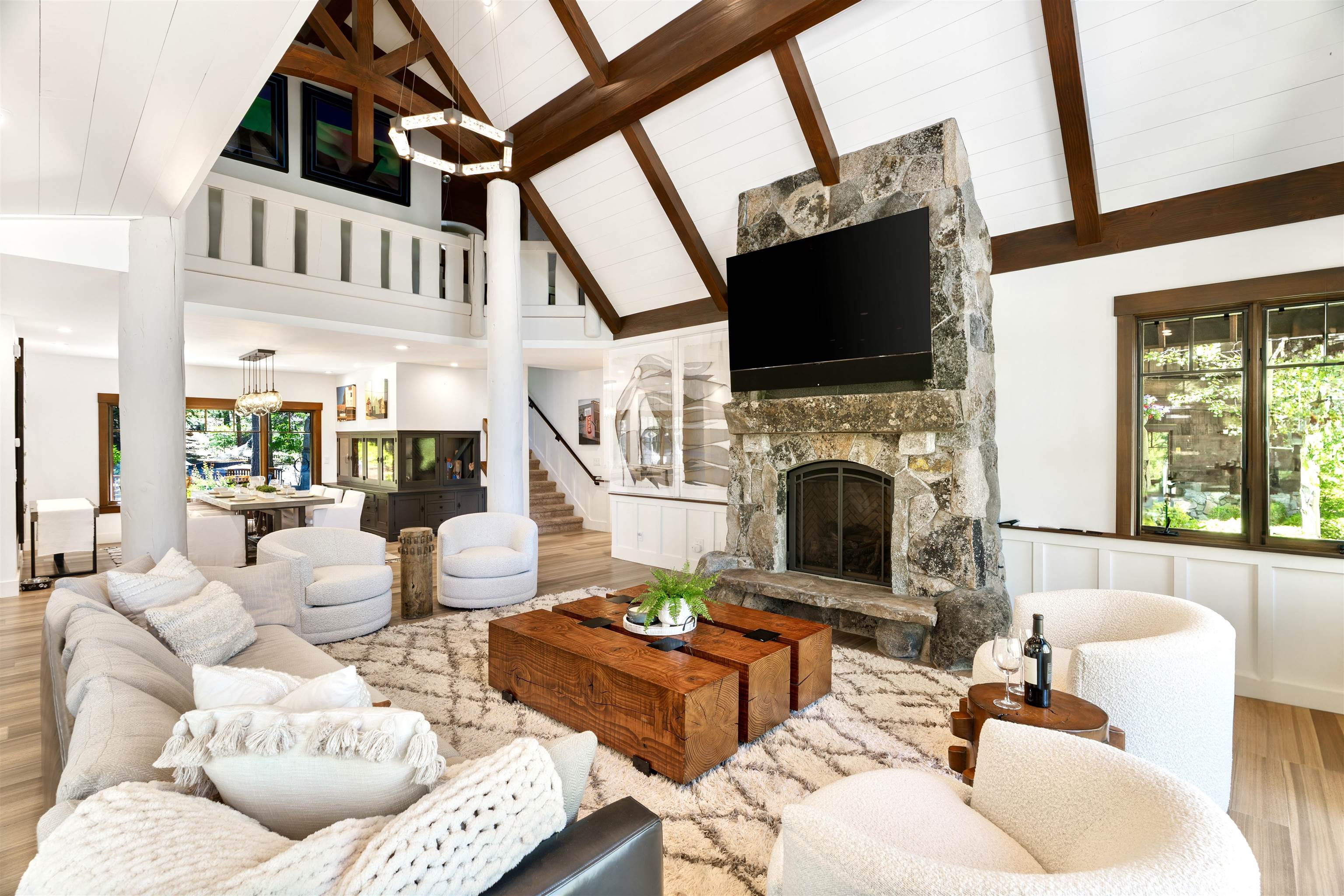 123 Dave Dysart Truckee, CA 96161 - Photo 3 of 28 a living room with furniture a flat screen tv and a fireplace