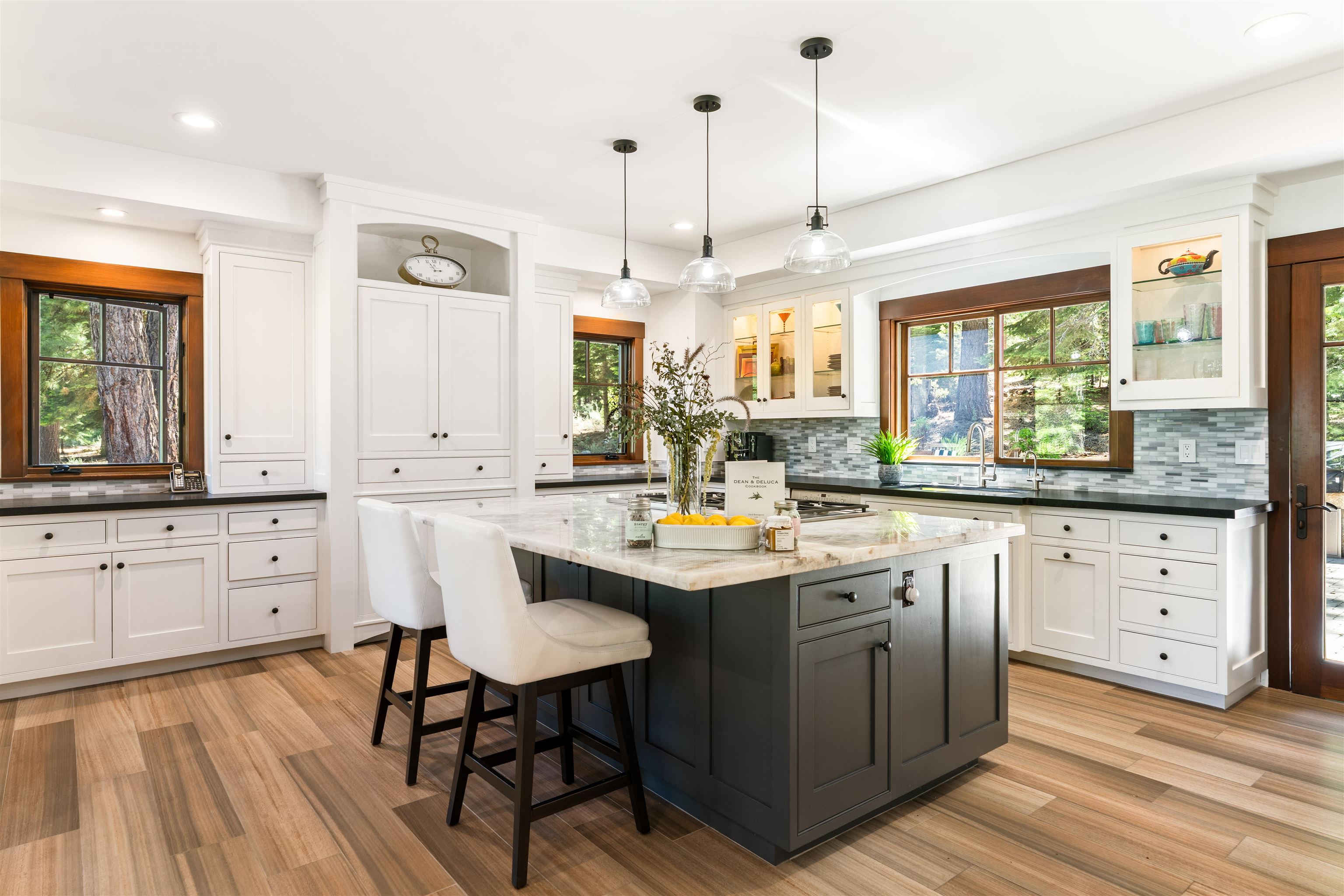 123 Dave Dysart Truckee, CA 96161 - Photo 8 of 28 a kitchen with white cabinets sink and stove
