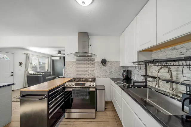 a kitchen with a stove and a sink