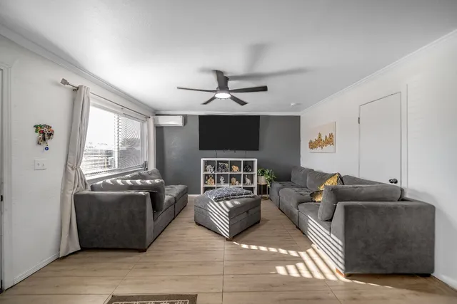 a living room with furniture and a window