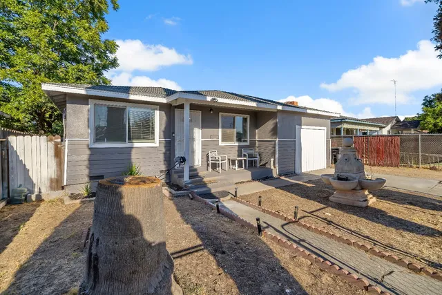 a front view of a house with a barbeque