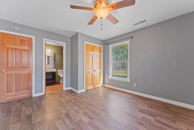 an aerial view of a house with a yard and a fountain