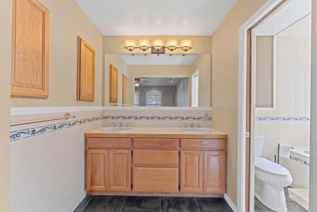 a house that has a tree in front of it