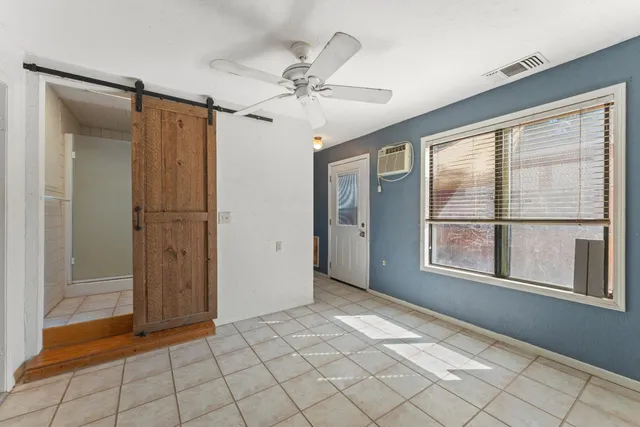 a view of a field with wooden fence