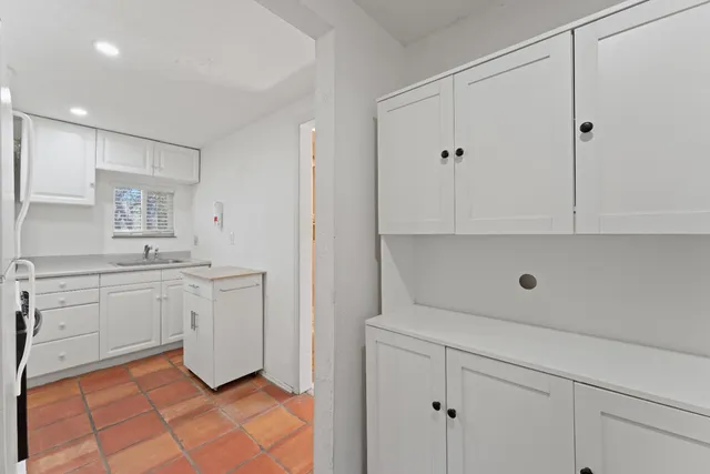 a view of yard covered with snow in front of house