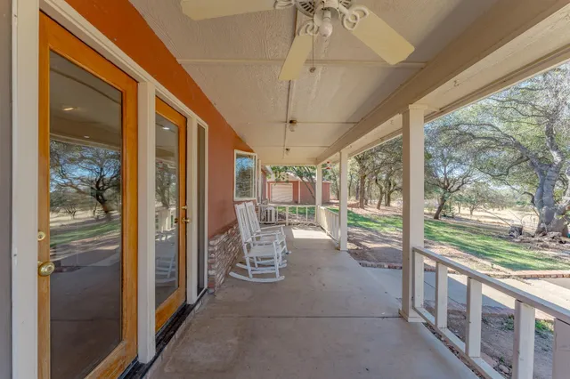 a view of a yard with swimming pool
