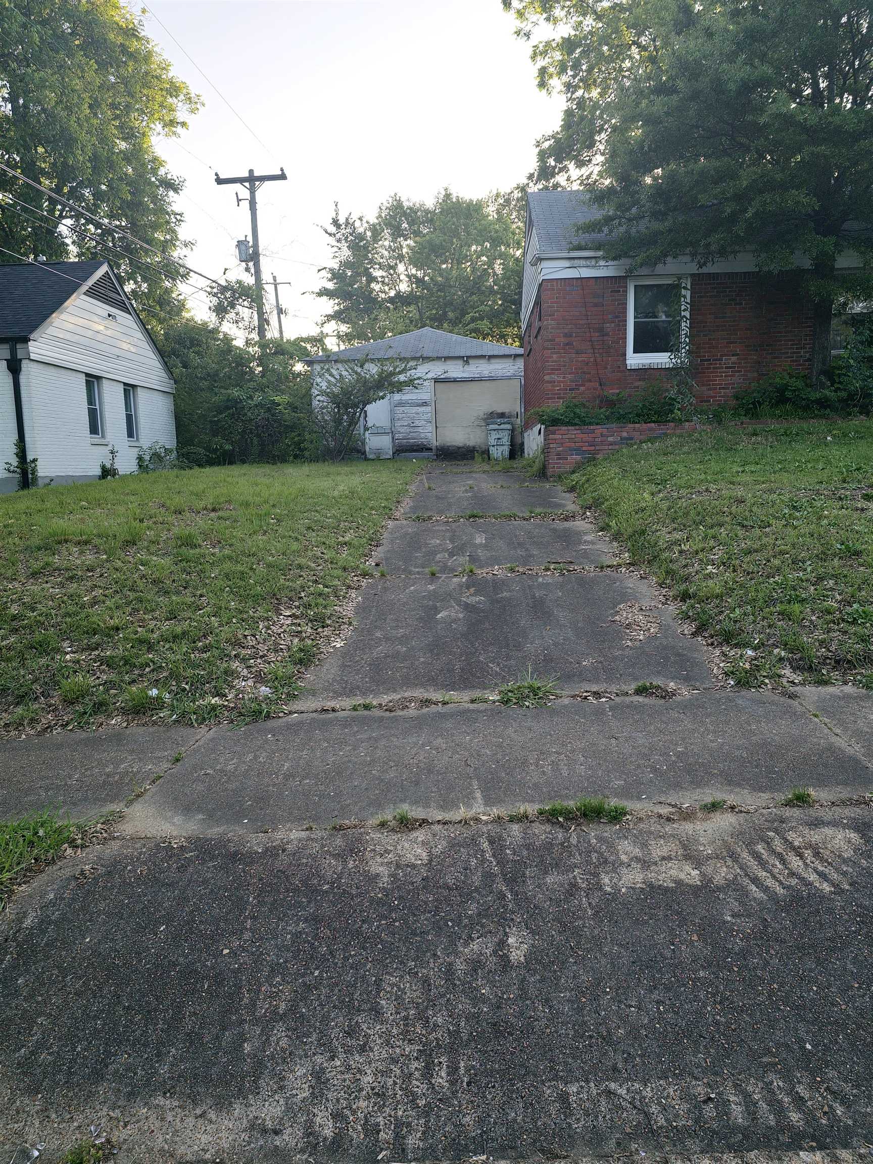 1515 Semmes Street Memphis, TN 38114 - Photo 4 of 9 Brick exterior home with white trim and a single window
