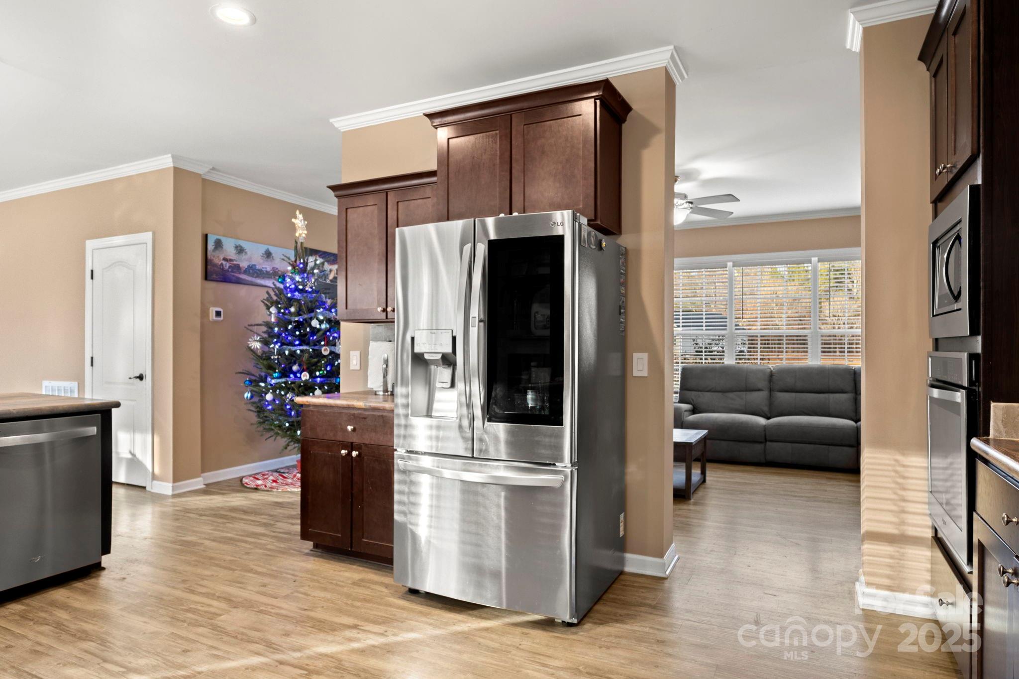 4290 Palmer Lloyd Road Lancaster, SC 29720 - Photo 28 of 48 a kitchen with stainless steel appliances kitchen island granite countertop a refrigerator and a sink