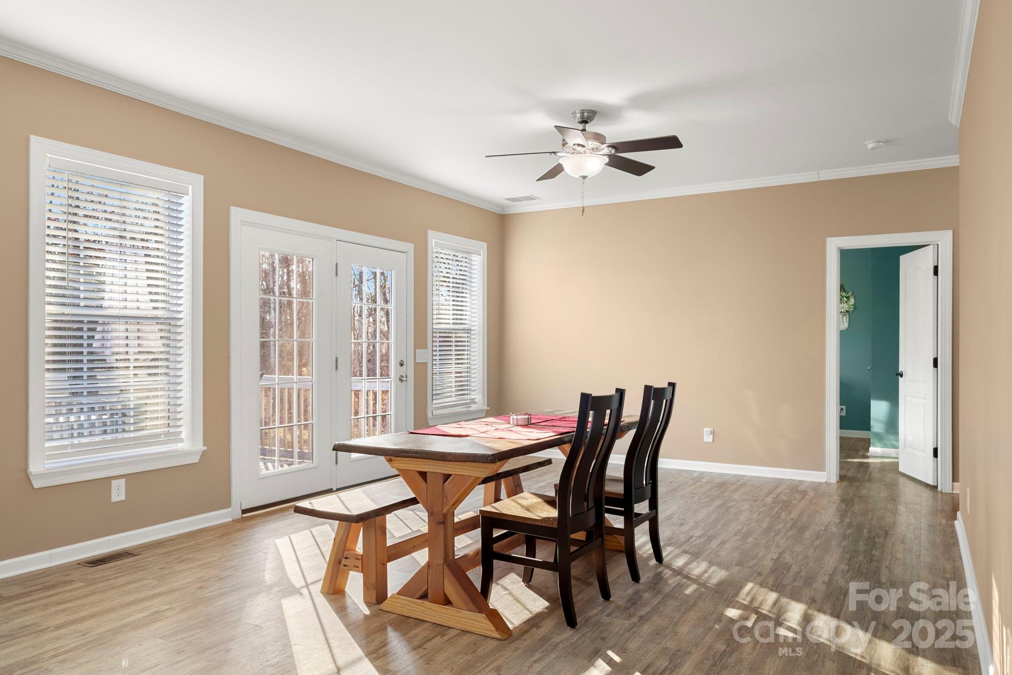 4290 Palmer Lloyd Road Lancaster, SC 29720 - Photo 30 of 48 a view of a dining room with furniture and wooden floor