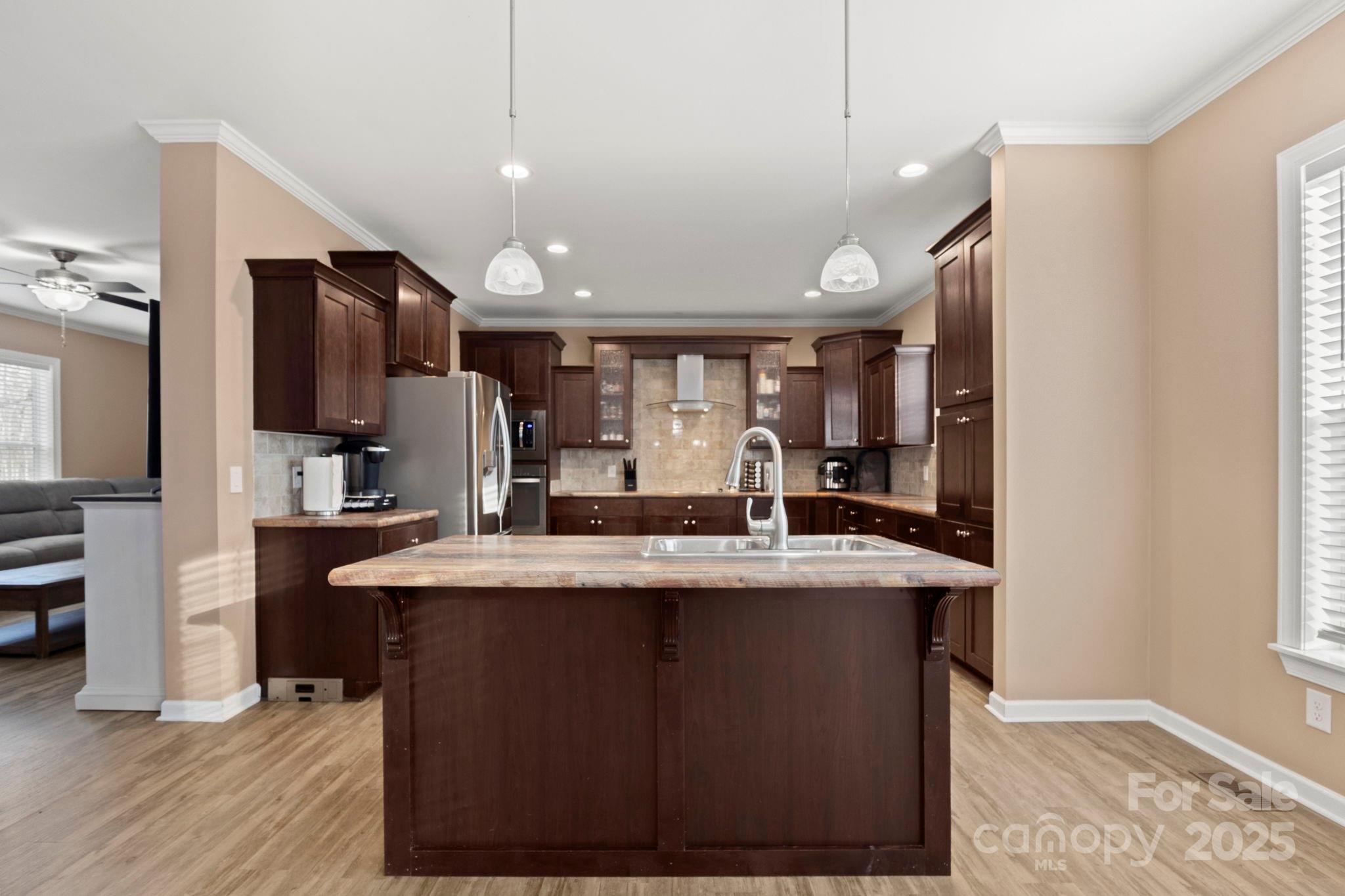 4290 Palmer Lloyd Road Lancaster, SC 29720 - Photo 3 of 48 a large kitchen with kitchen island a sink stainless steel appliances and cabinets