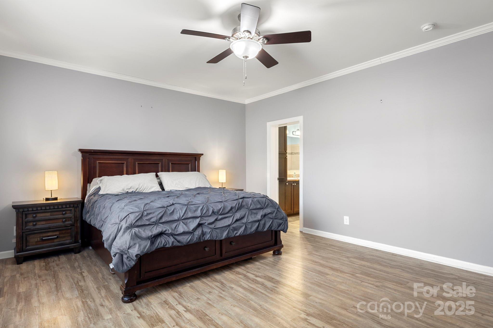 4290 Palmer Lloyd Road Lancaster, SC 29720 - Photo 39 of 48 a bedroom with a bed chandelier and a window