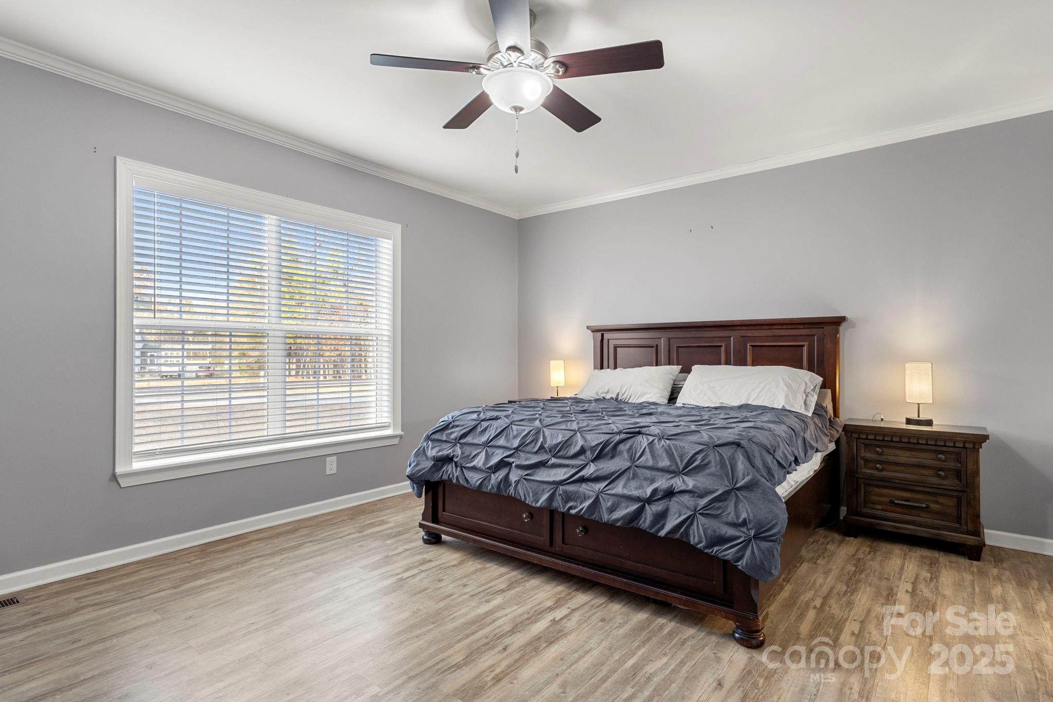 4290 Palmer Lloyd Road Lancaster, SC 29720 - Photo 4 of 48 a bedroom with a bed and a ceiling fan