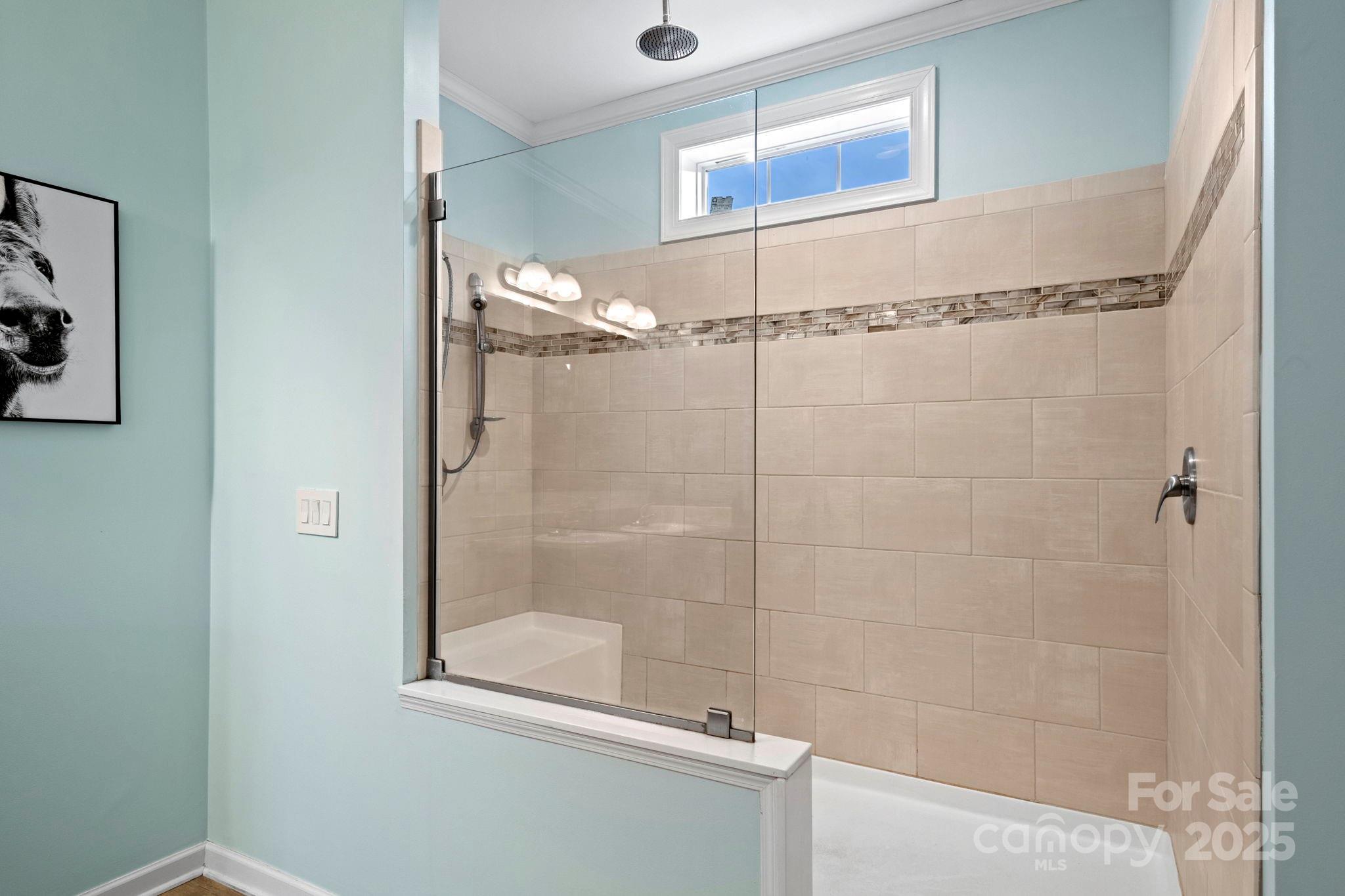 4290 Palmer Lloyd Road Lancaster, SC 29720 - Photo 43 of 48 a bathroom with a glass shower door