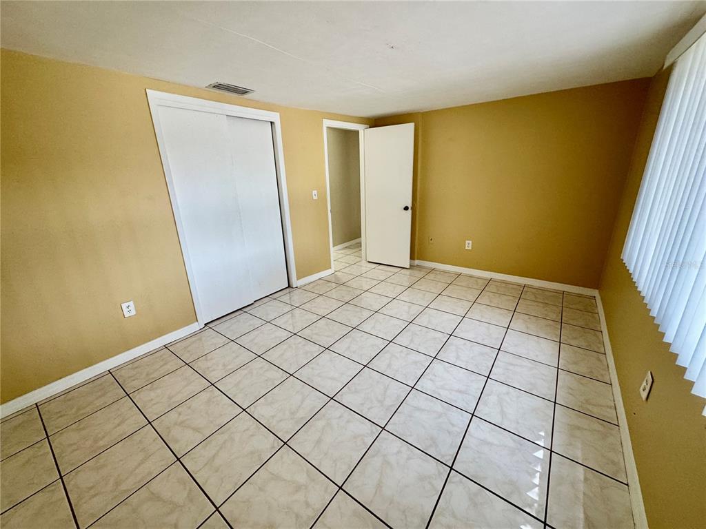 3049 Moog Road Holiday, FL 34691 - Photo 9 of 19 a view of an empty room and window