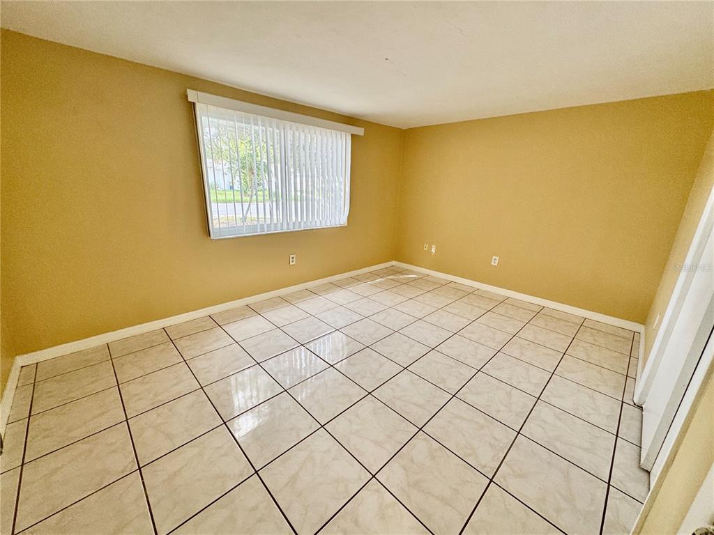 3049 Moog Road Holiday, FL 34691 - Photo 10 of 19 a view of an empty room and a window