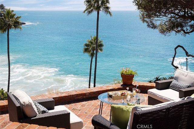 a view of balcony with couch and potted plants