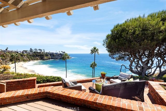 a view of a terrace with couches and sky view