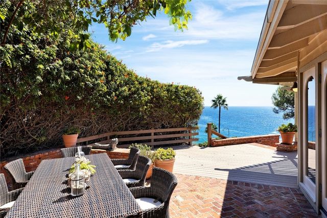 a view of roof deck with patio