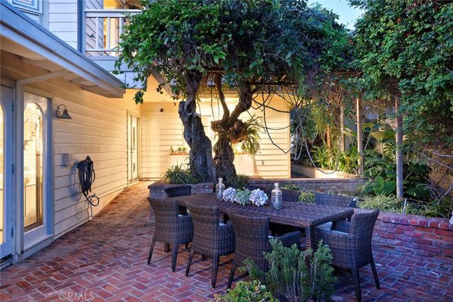 a view of an outdoor space with a table and chairs