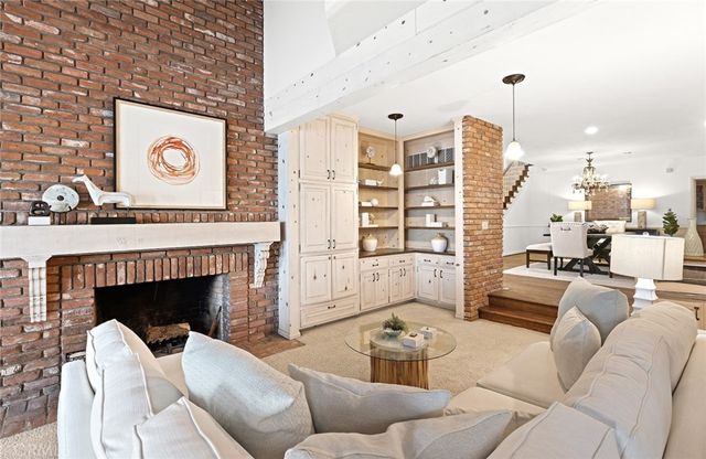 a view of a livingroom with furniture and a fireplace