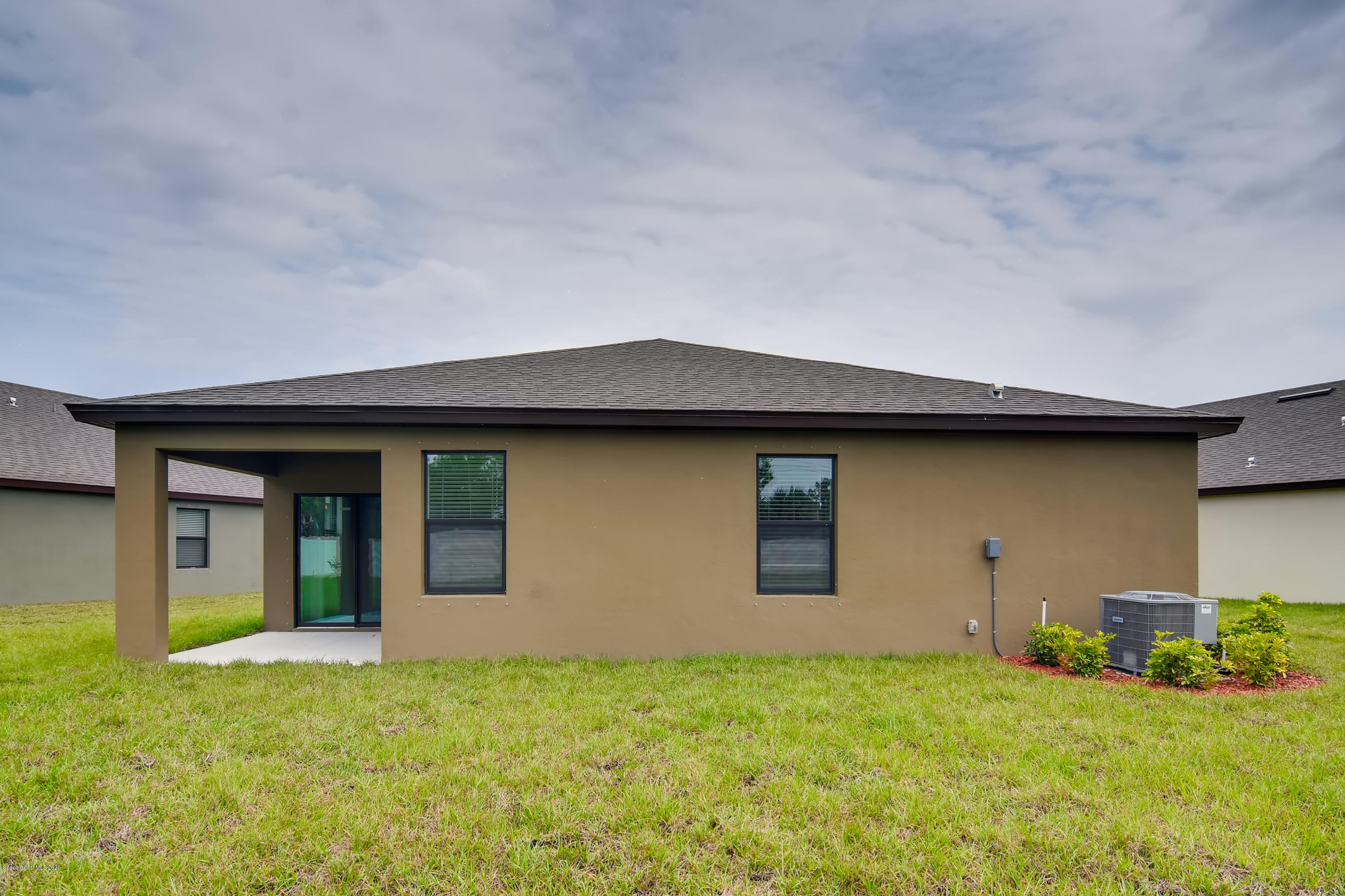 3697 Loggerhead Lane Mims, FL 32754 - Photo 12 of 42 REAR ELEVATION