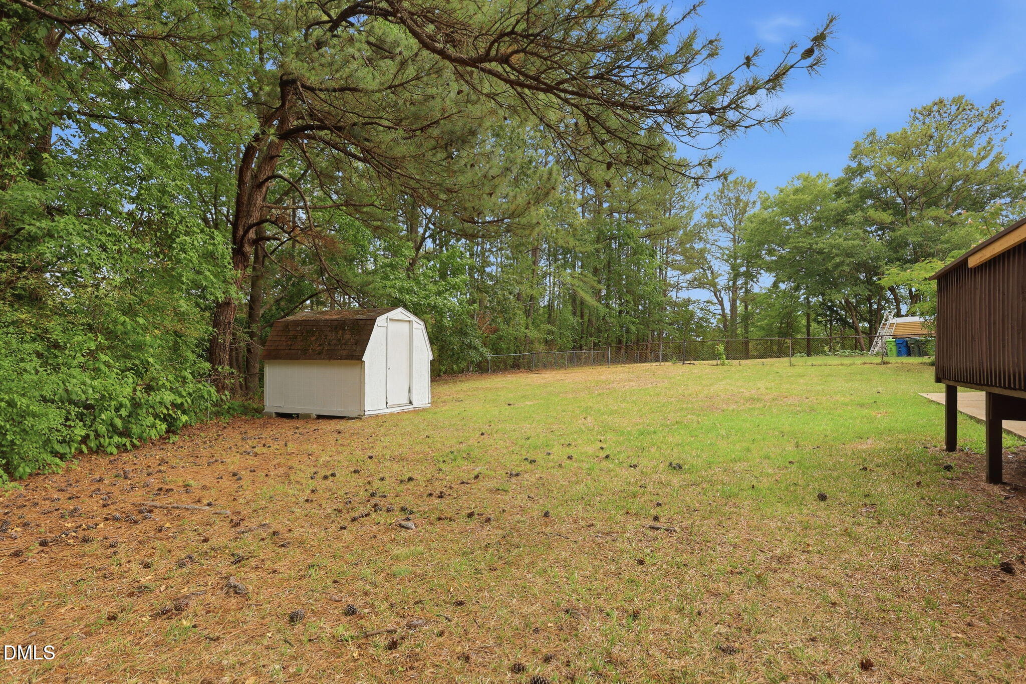 613 Juno Court Raleigh, NC 27610 - Photo 27 of 29 a backyard of a house with shaded area