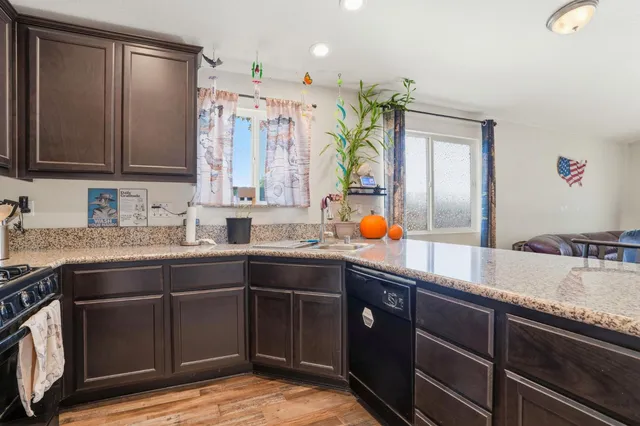 a kitchen with a sink stove and cabinets