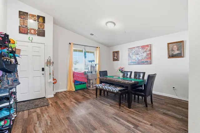 a room with a wooden floor and furniture