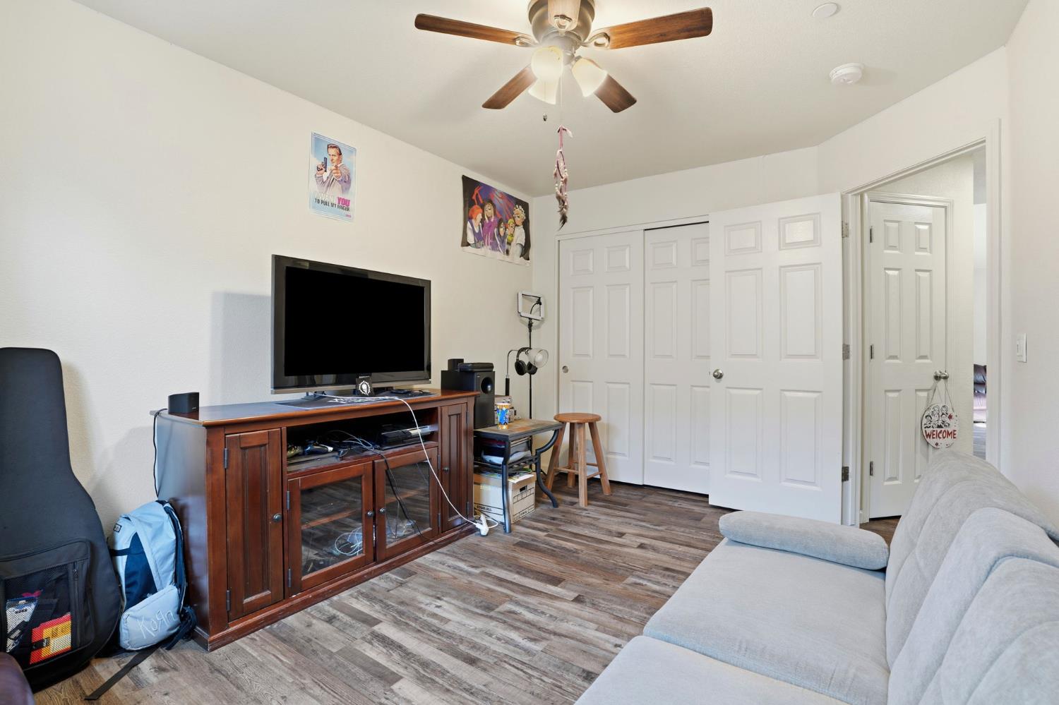 296 Dena Court Merced, CA 95341 - Photo 17 of 34 a living room with furniture and a flat screen tv