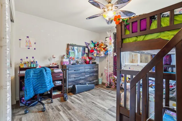 a bedroom with furniture and a window