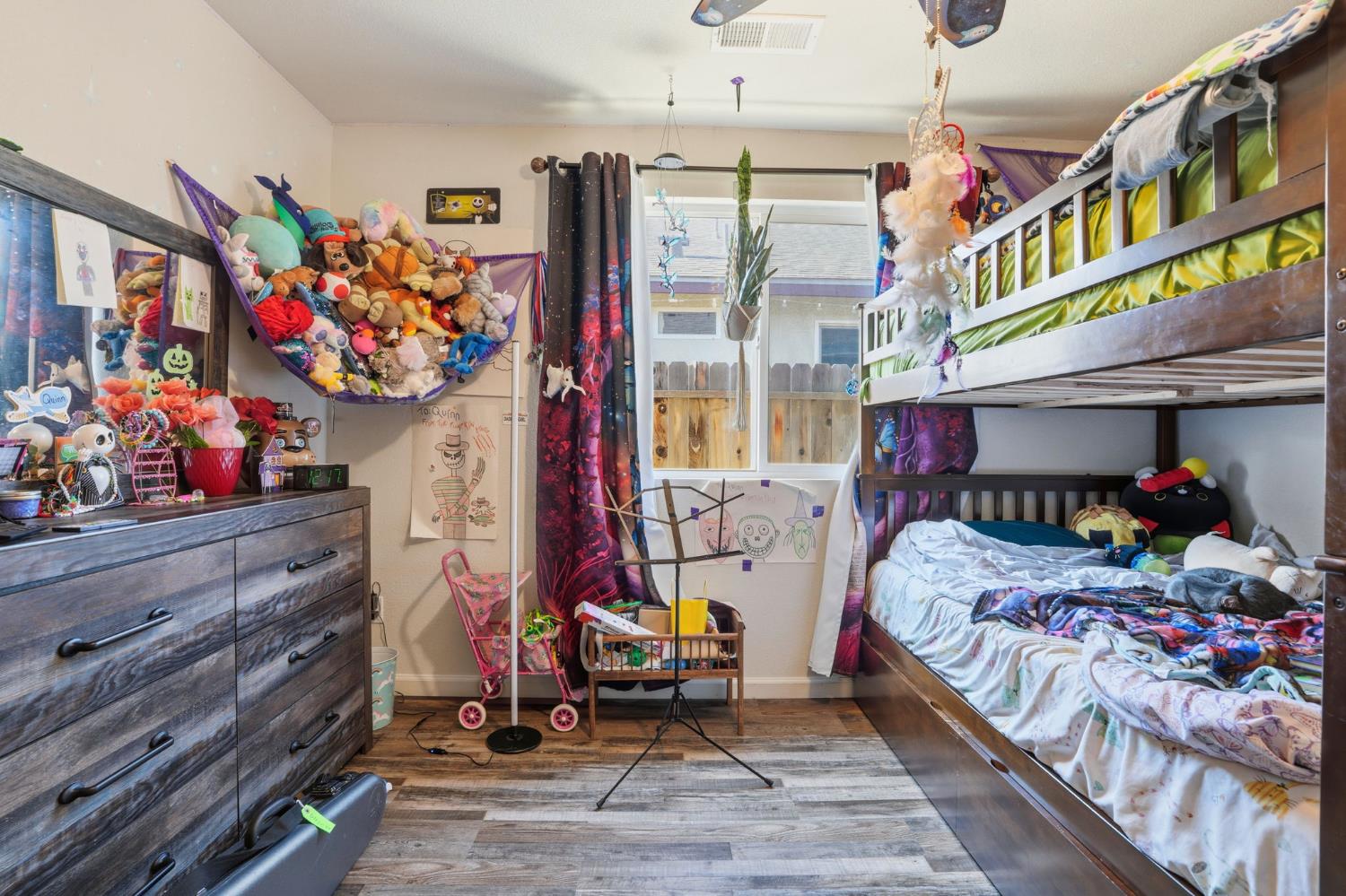 296 Dena Court Merced, CA 95341 - Photo 19 of 34 a bedroom with bed and a window