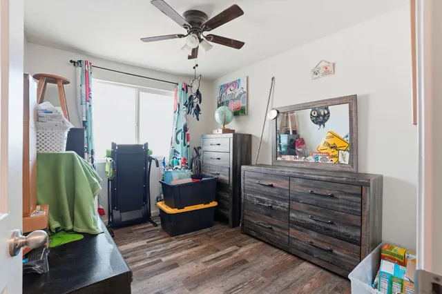 a view of living room with furniture and a flat screen tv