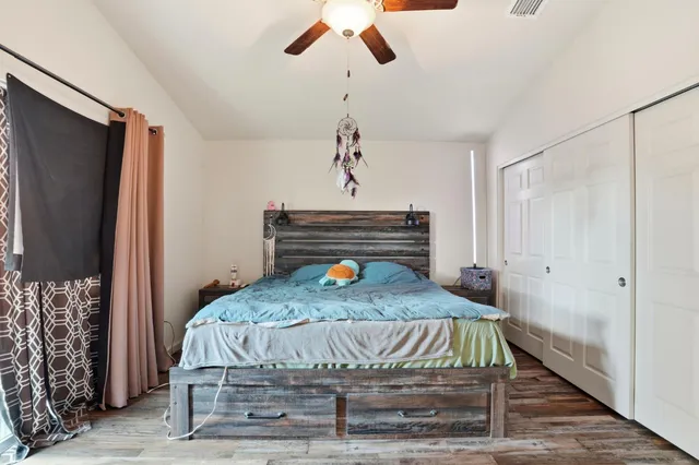 a bed sitting in a room next to a window