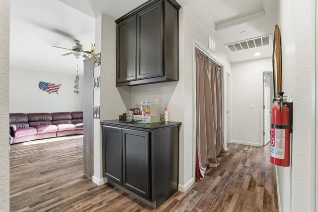a kitchen with stainless steel appliances granite countertop a refrigerator and a stove