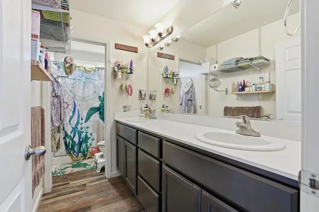 a bathroom with a sink double vanity and a mirror
