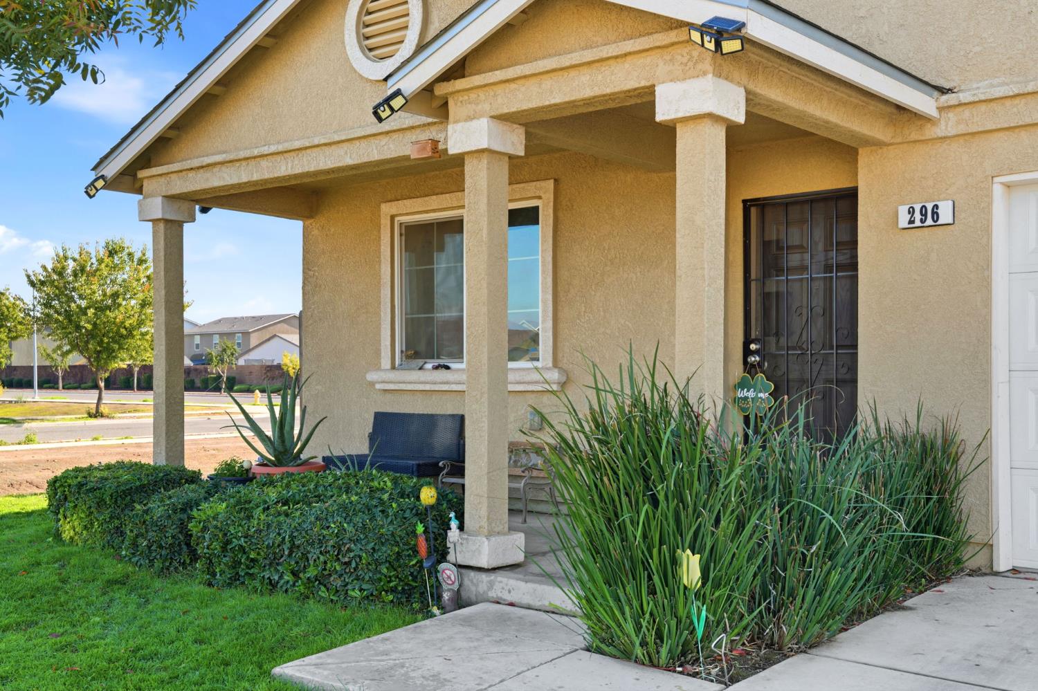 296 Dena Court Merced, CA 95341 - Photo 4 of 34 a front view of a house with garden