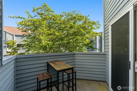 a view of a two chairs in the balcony