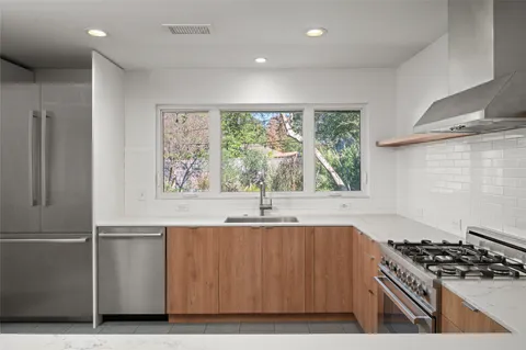 a kitchen with a table and chairs