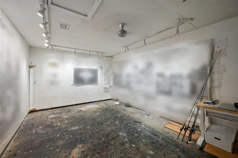 a view of a livingroom with furniture and a window