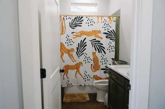 a close view of a door and a bathroom with a mirror