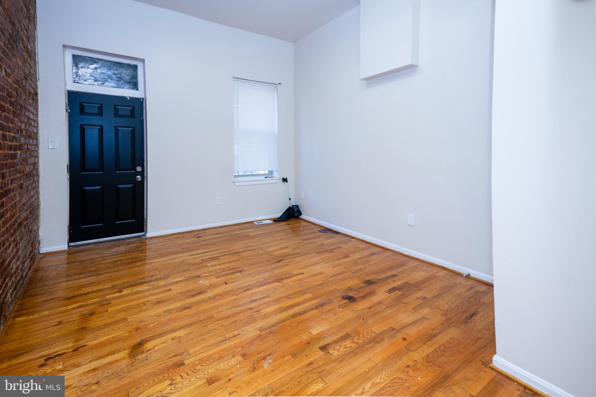 812 Newington Avenue Baltimore, MD 21217 - Photo 11 of 38 a view of empty room with wooden floor