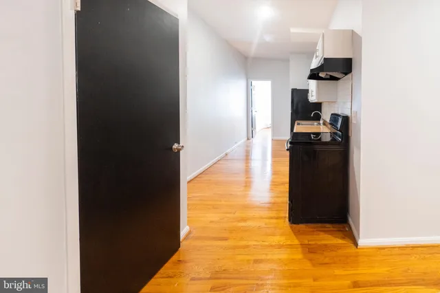 a kitchen with stainless steel appliances granite countertop a refrigerator and a stove