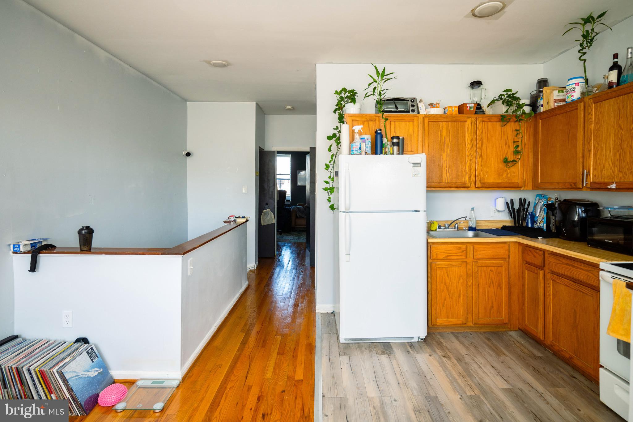 812 Newington Avenue Baltimore, MD 21217 - Photo 28 of 38 a kitchen with a refrigerator and a stove