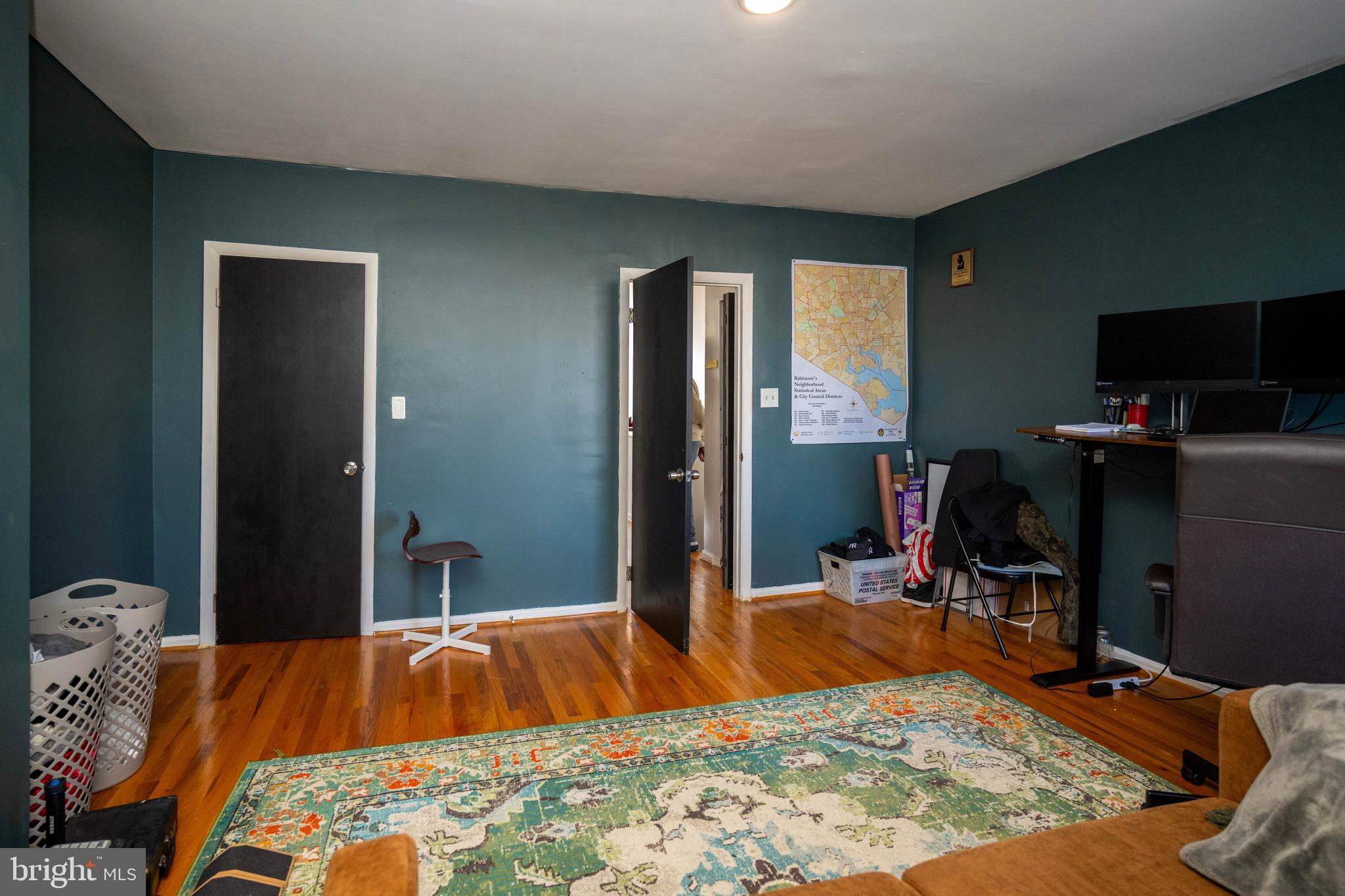 812 Newington Avenue Baltimore, MD 21217 - Photo 33 of 38 a bedroom with bed and flat screen tv