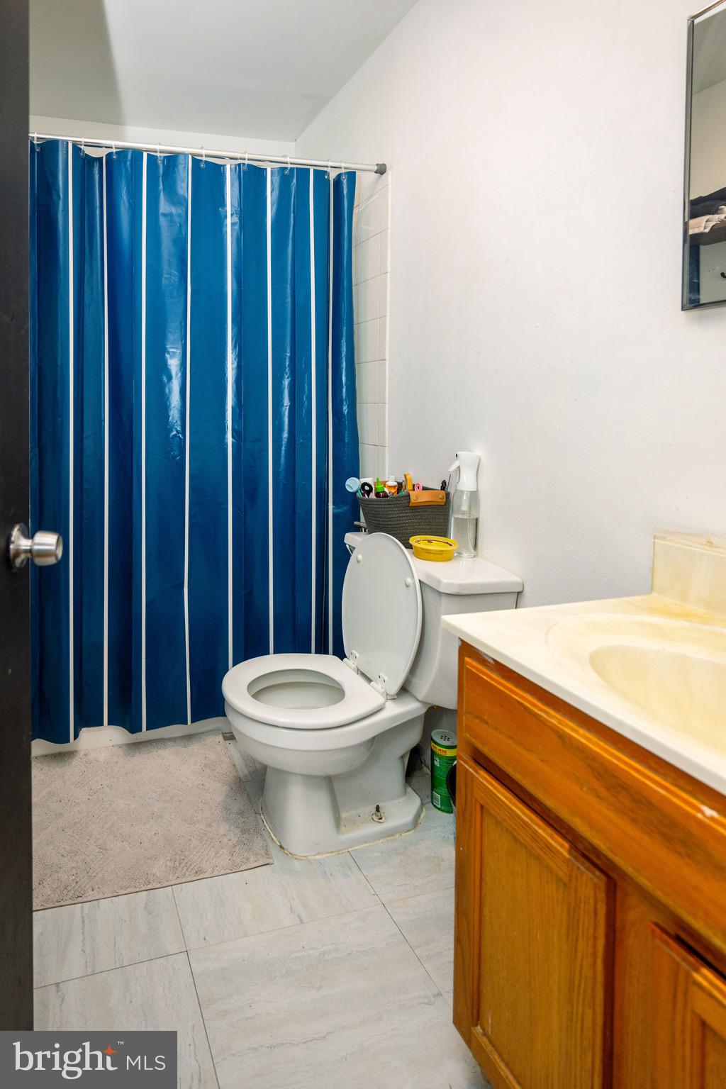 812 Newington Avenue Baltimore, MD 21217 - Photo 34 of 38 a bathroom with a sink a toilet and shower