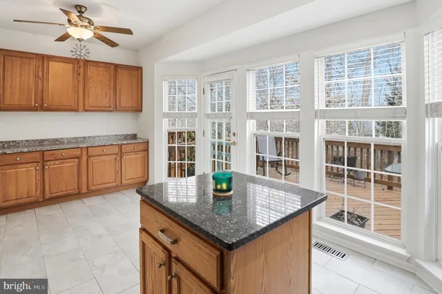 a kitchen with stainless steel appliances granite countertop a granite counter tops and a view of kitchen