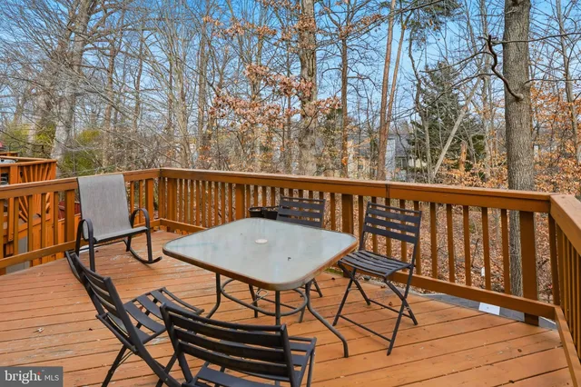a view of a chairs and table on the deck