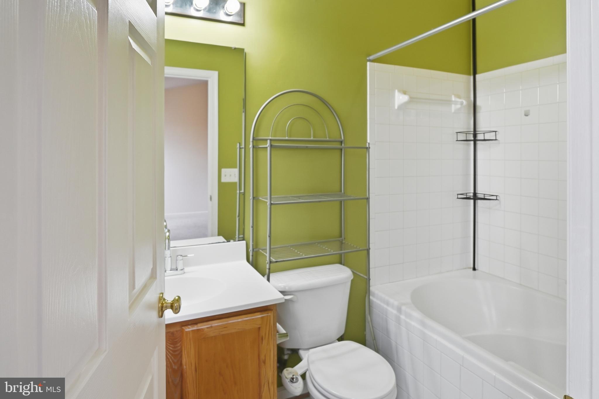 7858 Seafarer Way Lorton, VA 22079 - Photo 19 of 31 a bathroom with a sink a toilet and shower