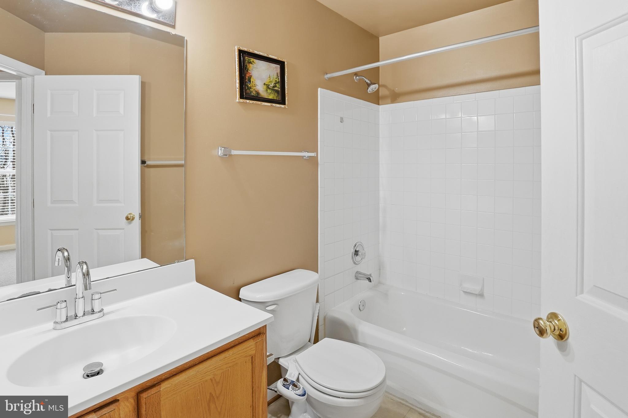 7858 Seafarer Way Lorton, VA 22079 - Photo 21 of 31 a bathroom with a sink toilet and shower