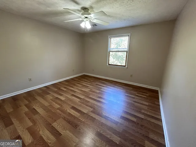 a view of a field with an ocean